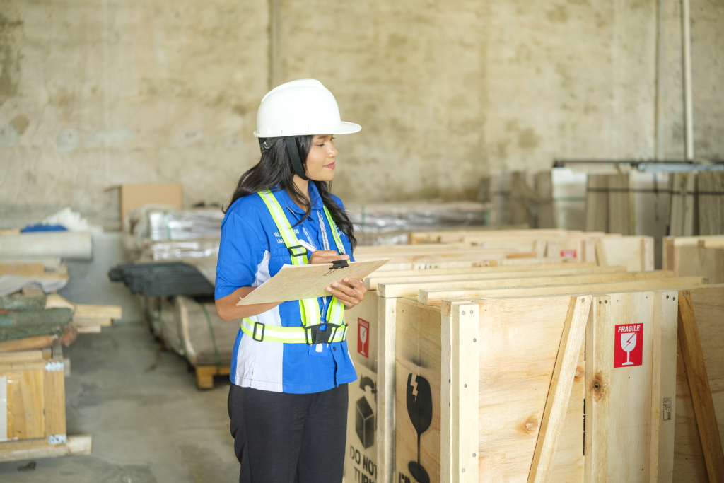 Jalak Kargo warehouse crew checking export crates in Indonesia